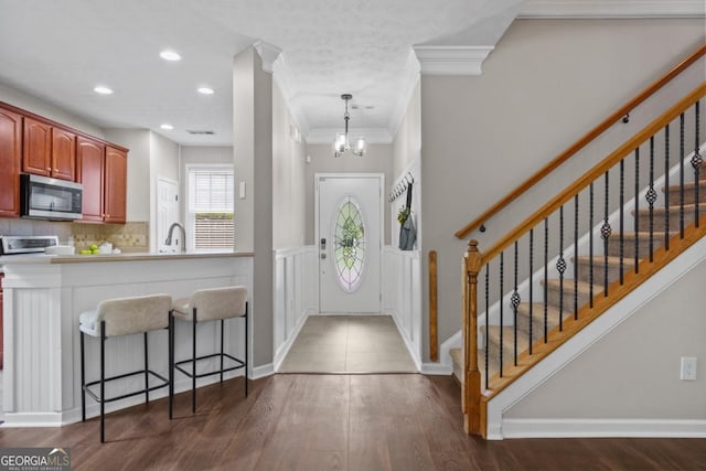 4020 New Salem Ct, Cumming, GA 30040 - entryway featuring crown molding, dark wood-style floors, stairway, a chandelier, and recessed lighting