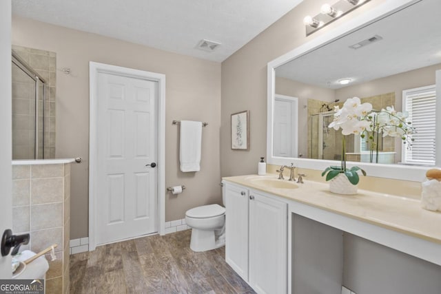 4020 New Salem Ct, Cumming, GA 30040 - full bath with a tile shower, wood finished floors, and vanity