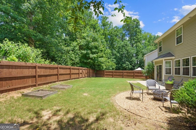 4020 New Salem Ct, Cumming, GA 30040 - fenced backyard with an outdoor fire pit and a vegetable garden