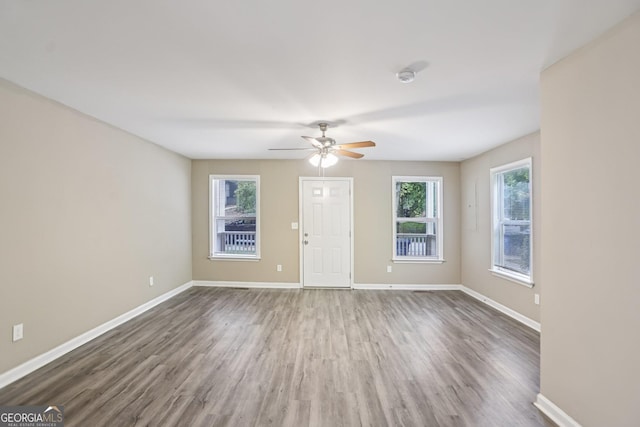 1159 Smith St SW, Atlanta, GA 30310 - unfurnished living room with wood finished floors and ceiling fan