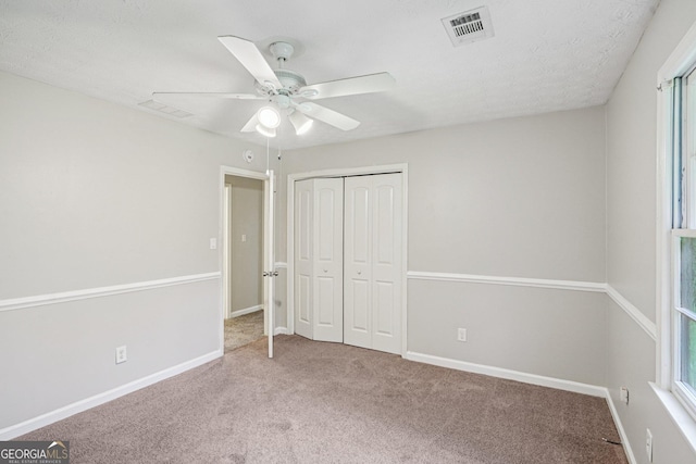 5618 Shadow Rock Dr, Lithonia, GA 30058 - unfurnished bedroom featuring carpet flooring, a closet, and ceiling fan