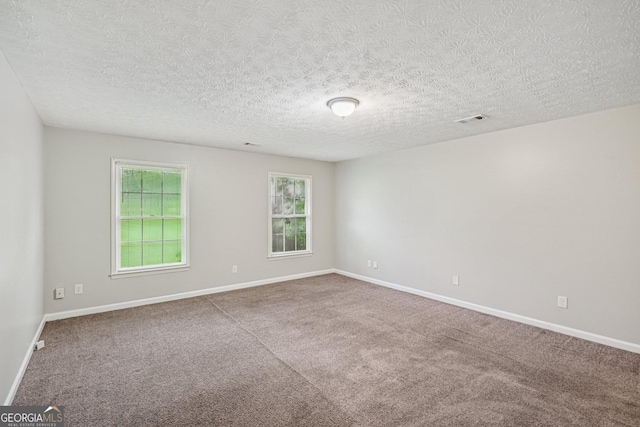 5618 Shadow Rock Dr, Lithonia, GA 30058 - carpeted spare room featuring baseboards and a textured ceiling