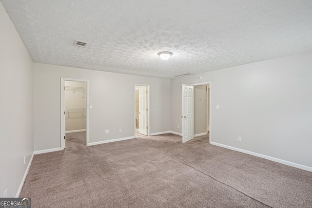 5618 Shadow Rock Dr, Lithonia, GA 30058 - carpeted spare room featuring a textured ceiling