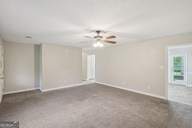 5618 Shadow Rock Dr, Lithonia, GA 30058 - empty room featuring a ceiling fan, carpet flooring, and a textured ceiling