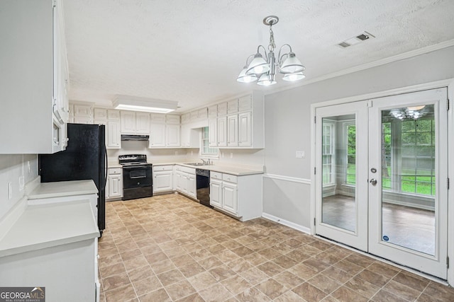 5618 Shadow Rock Dr, Lithonia, GA 30058 - kitchen featuring black appliances, a chandelier, under cabinet range hood, french doors, and light countertops