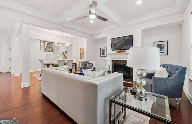 5534 Parkerton Ln, Sandy Springs, GA 30342 - living room featuring dark wood finished floors, a ceiling fan, a fireplace, beam ceiling, and coffered ceiling