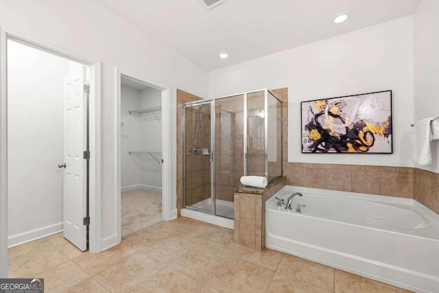 5534 Parkerton Ln, Sandy Springs, GA 30342 - bathroom with a shower stall, a bath, tile patterned floors, a walk in closet, and recessed lighting