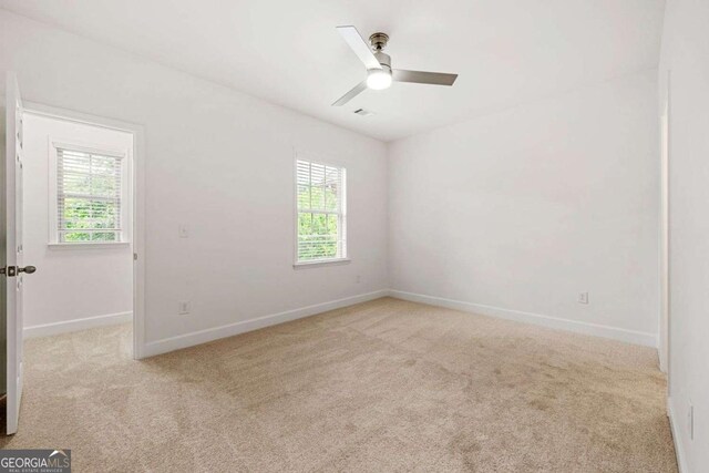 5534 Parkerton Ln, Sandy Springs, GA 30342 - carpeted spare room featuring a ceiling fan and baseboards