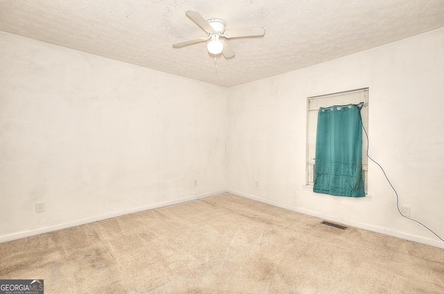 67 Cotton St, Commerce, GA 30529 - unfurnished room featuring carpet, a textured ceiling, and ceiling fan
