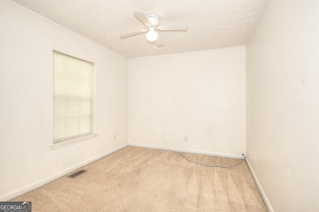67 Cotton St, Commerce, GA 30529 - spare room featuring carpet, a ceiling fan, and a textured ceiling