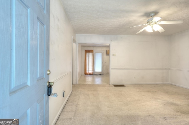 67 Cotton St, Commerce, GA 30529 - empty room featuring carpet, a ceiling fan, and a textured ceiling
