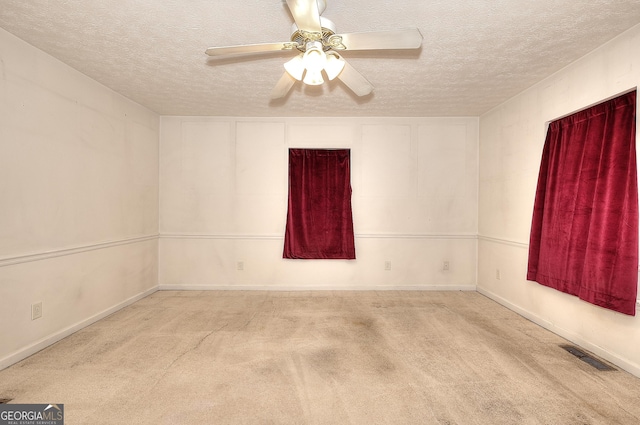 67 Cotton St, Commerce, GA 30529 - carpeted spare room featuring a textured ceiling and a ceiling fan