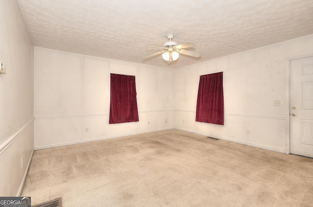 67 Cotton St, Commerce, GA 30529 - unfurnished room with a ceiling fan, carpet flooring, and a textured ceiling