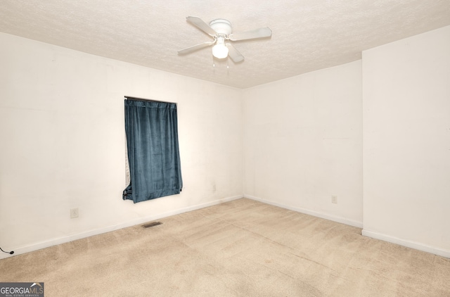67 Cotton St, Commerce, GA 30529 - carpeted spare room with a textured ceiling and a ceiling fan