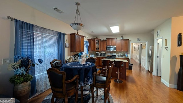 2435 Hickory Station Cir, Snellville, GA 30078 - dining room with dark wood-style floors