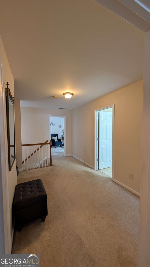 2435 Hickory Station Cir, Snellville, GA 30078 - hall featuring carpet floors and an upstairs landing