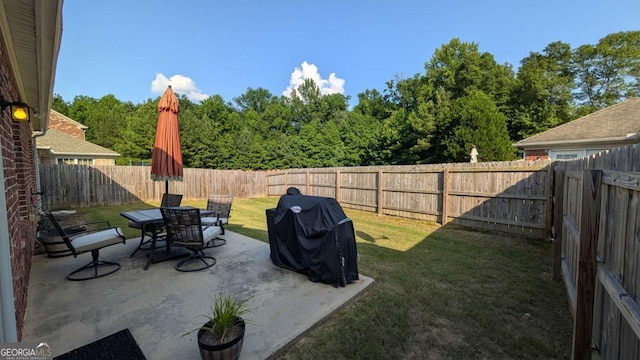 2435 Hickory Station Cir, Snellville, GA 30078 - fenced backyard featuring a patio area and outdoor dining area
