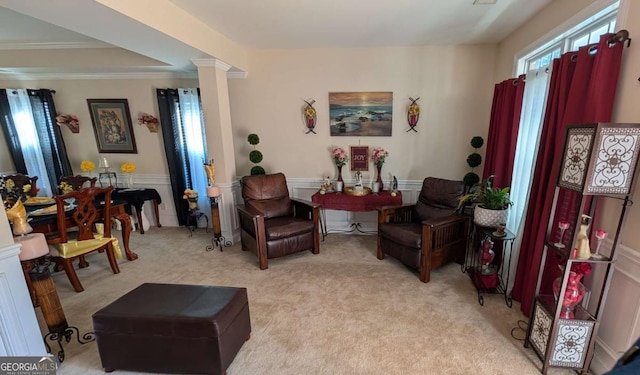 2435 Hickory Station Cir, Snellville, GA 30078 - living area with light carpet, ornamental molding, ornate columns, and wainscoting