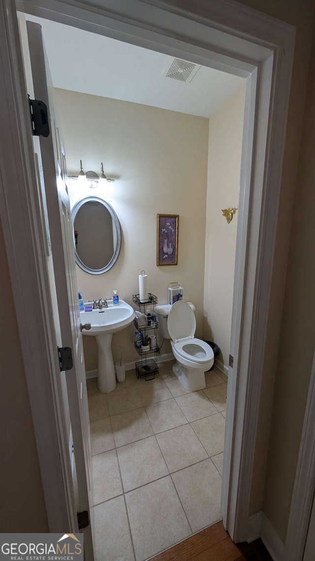 2435 Hickory Station Cir, Snellville, GA 30078 - bathroom featuring tile patterned flooring and toilet