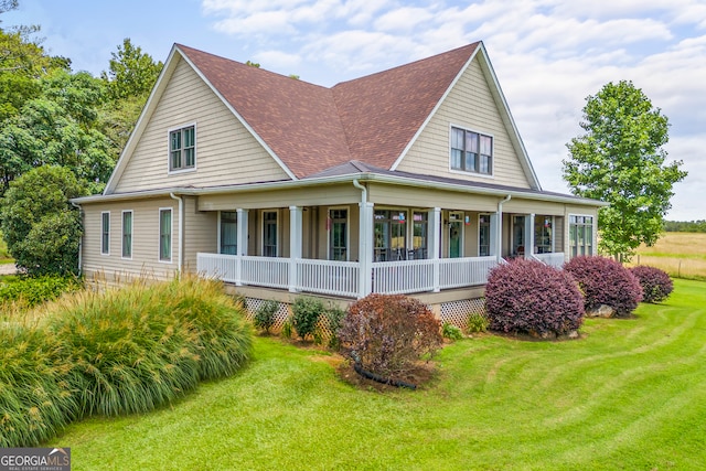 290 Vinson Rd, Tignall, GA 30668 - view of front of house with covered porch, a shingled roof, and a front lawn