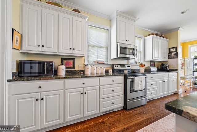 290 Vinson Rd, Tignall, GA 30668 - kitchen featuring stainless steel appliances, white cabinets, ornamental molding, dark wood finished floors, and dark stone counters