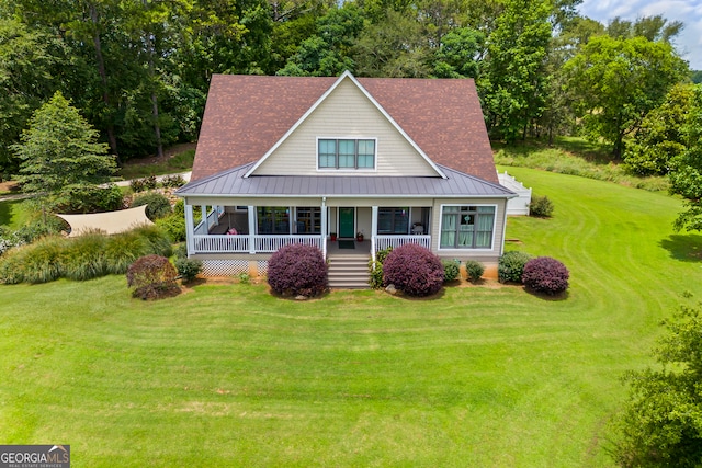 290 Vinson Rd, Tignall, GA 30668 - view of front of property featuring a standing seam roof, covered porch, a front lawn, and a metal roof
