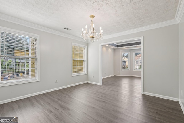 2379 Fallbrook Ct, Duluth, GA 30096 - spare room featuring a chandelier, a textured ceiling, plenty of natural light, dark wood-style flooring, and crown molding
