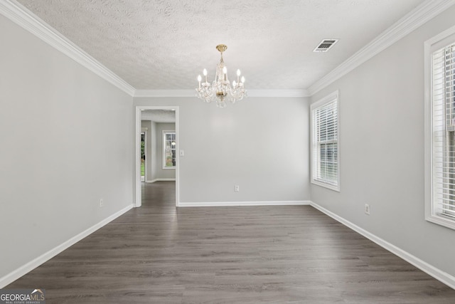 2379 Fallbrook Ct, Duluth, GA 30096 - unfurnished room featuring a chandelier, crown molding, dark wood-style flooring, and a textured ceiling