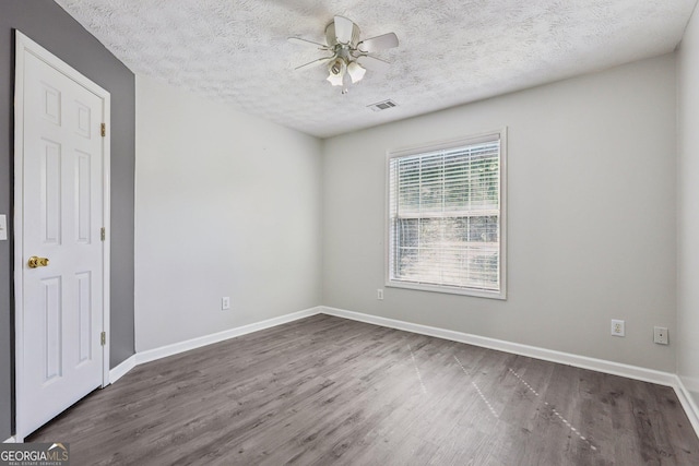 2379 Fallbrook Ct, Duluth, GA 30096 - empty room with ceiling fan, wood finished floors, and a textured ceiling