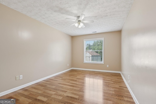 2379 Fallbrook Ct, Duluth, GA 30096 - spare room featuring light wood-style flooring, a textured ceiling, and ceiling fan