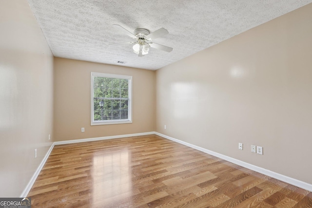 2379 Fallbrook Ct, Duluth, GA 30096 - spare room featuring light wood-type flooring, ceiling fan, and a textured ceiling