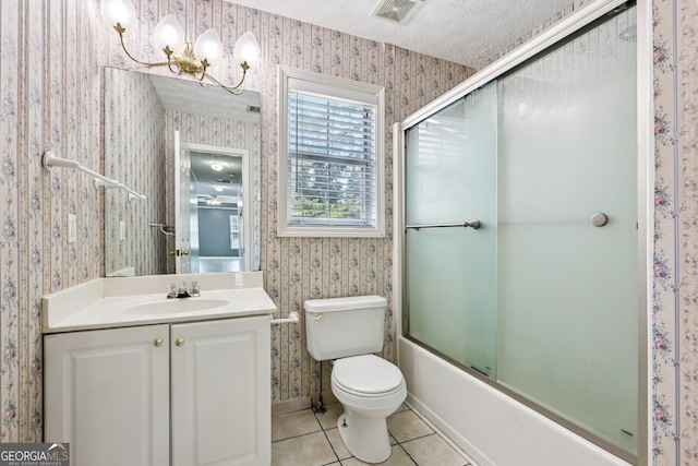 2379 Fallbrook Ct, Duluth, GA 30096 - bathroom with wallpapered walls, vanity, combined bath / shower with glass door, tile patterned flooring, and a textured ceiling