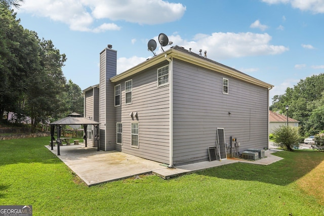 2379 Fallbrook Ct, Duluth, GA 30096 - rear view of property with a gazebo, a patio, a chimney, and a yard