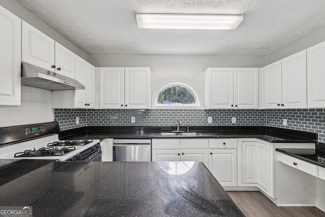 2379 Fallbrook Ct, Duluth, GA 30096 - kitchen with under cabinet range hood, dishwasher, gas range, white cabinetry, and decorative backsplash