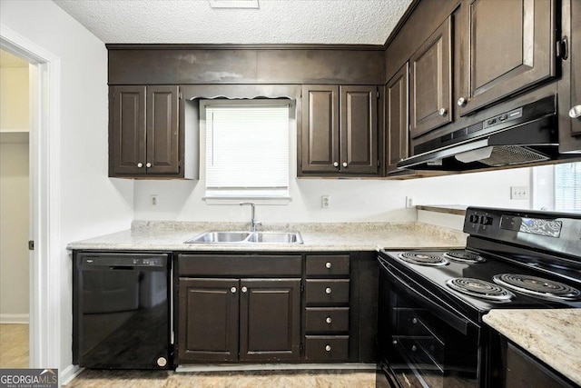 4801 Wilson Rd, Macon, GA 31206 - kitchen with black appliances, under cabinet range hood, dark brown cabinetry, light countertops, and a textured ceiling