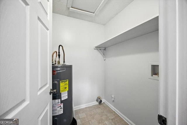 4801 Wilson Rd, Macon, GA 31206 - laundry room featuring electric water heater, washer hookup, and hookup for an electric dryer