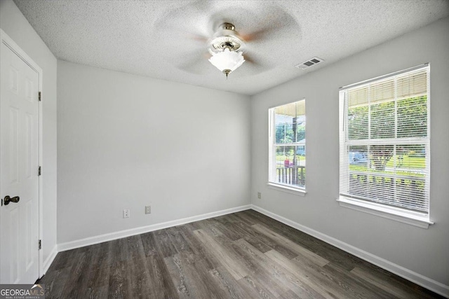 4801 Wilson Rd, Macon, GA 31206 - empty room with dark wood-style flooring, a textured ceiling, and ceiling fan