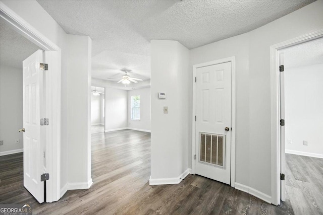 4801 Wilson Rd, Macon, GA 31206 - hall with dark wood-style floors and a textured ceiling