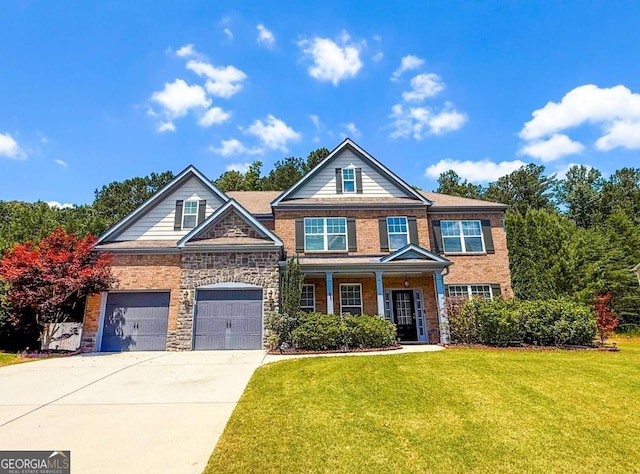 250 Mulberry Dr, Senoia, GA 30276 - view of front facade featuring concrete driveway, a front lawn, a porch, brick siding, and stone siding