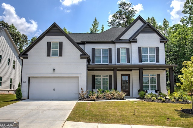 841 Keystone Dr, Woodstock, GA 30188 - traditional home with brick siding, a garage, a front yard, driveway, and covered porch