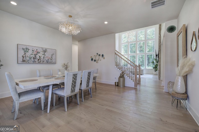 841 Keystone Dr, Woodstock, GA 30188 - dining room with a chandelier, recessed lighting, light wood-style floors, and stairway