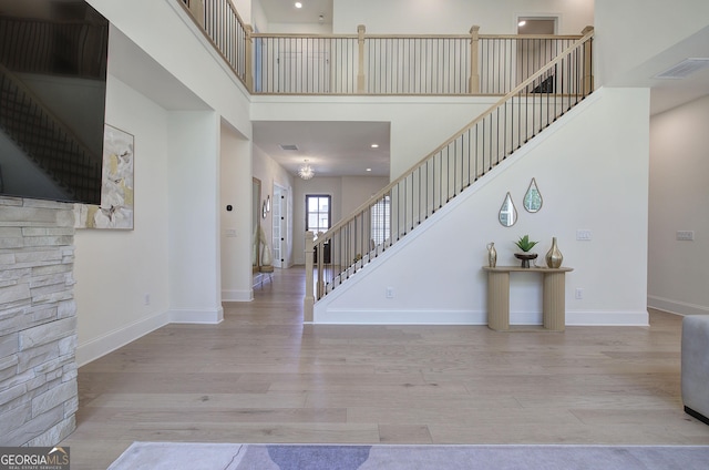 841 Keystone Dr, Woodstock, GA 30188 - entrance foyer with stairs, wood finished floors, and a high ceiling