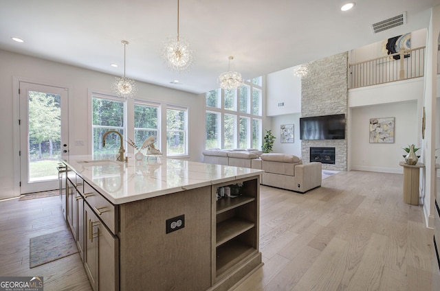 841 Keystone Dr, Woodstock, GA 30188 - kitchen featuring a chandelier, plenty of natural light, light wood finished floors, open shelves, and recessed lighting