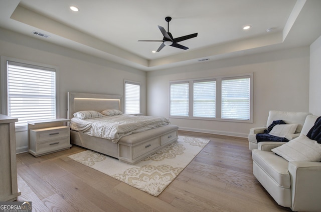 841 Keystone Dr, Woodstock, GA 30188 - bedroom with a raised ceiling, light wood finished floors, recessed lighting, and ceiling fan