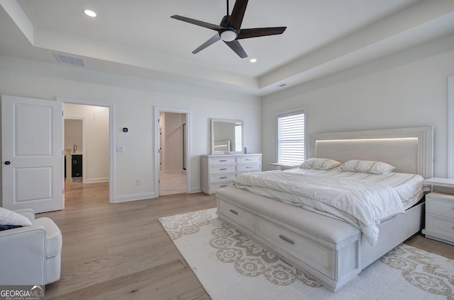 841 Keystone Dr, Woodstock, GA 30188 - bedroom with a raised ceiling, light wood finished floors, recessed lighting, and a ceiling fan