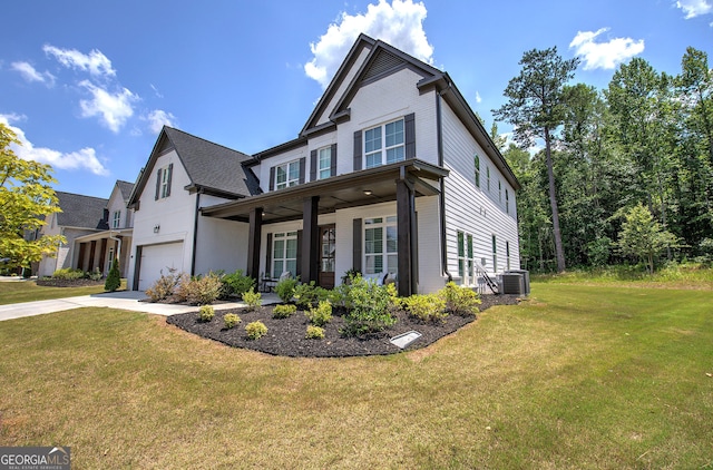 841 Keystone Dr, Woodstock, GA 30188 - view of front of home featuring an attached garage, a front yard, driveway, and covered porch