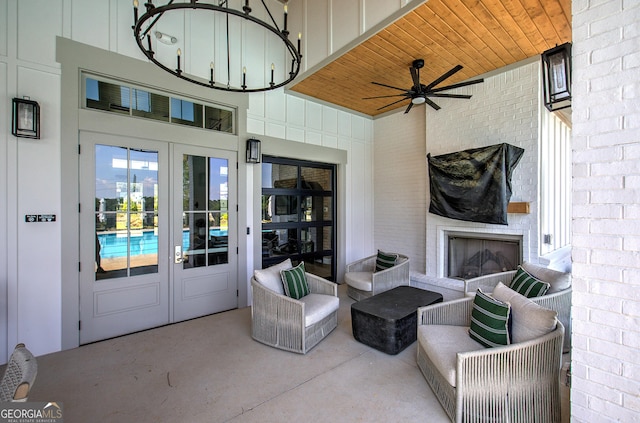 841 Keystone Dr, Woodstock, GA 30188 - view of patio / terrace with an outdoor brick fireplace, french doors, and a ceiling fan