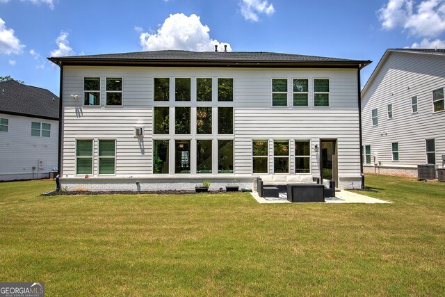 841 Keystone Dr, Woodstock, GA 30188 - rear view of house featuring outdoor lounge area, a lawn, and a patio area