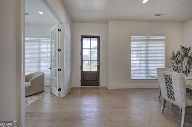 841 Keystone Dr, Woodstock, GA 30188 - foyer with light wood finished floors, recessed lighting, and french doors