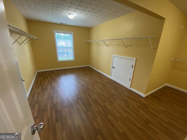 1472 Queenie Smith Rd NE, Conyers, GA 30012 - walk in closet featuring wood finished floors